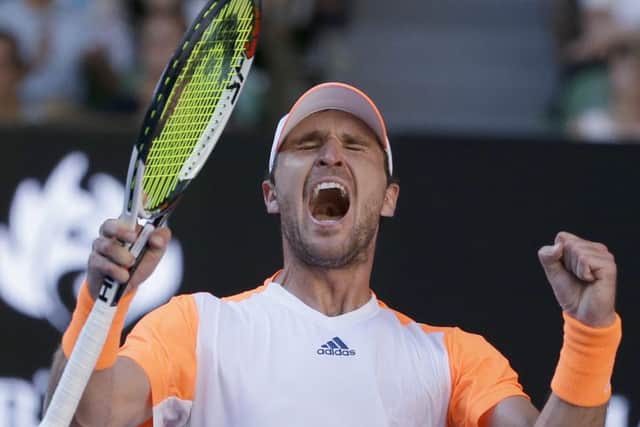Germany's Mischa Zverev celebrates defeating Britain's Andy Murray in their fourth round match at the Australian Open. (AP Photo/Aaron Favila)