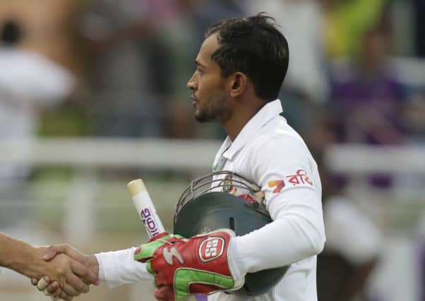 Bangladesh's captain Mushfiqur Rahim, right (AP Photo/A.M. Ahad)