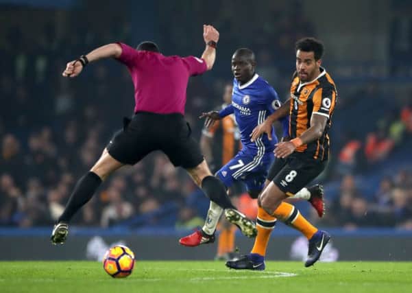 Referee Neil Swarbrick jumps out of the way of the ball during Hull City's 2-0 loss at Chelsea. Swarbrick upset the Tigers when he failed to award a penalty when Abel Hernandez was clearly fouled (Picture: Nick Potts/PA Wire).