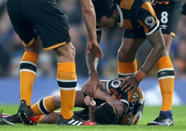 Hull City's Ryan Mason lies injured after fracturing his skull in a clash of heads with Chelsea's Gary Cahill (Picture: Nick Potts/PA Wire).