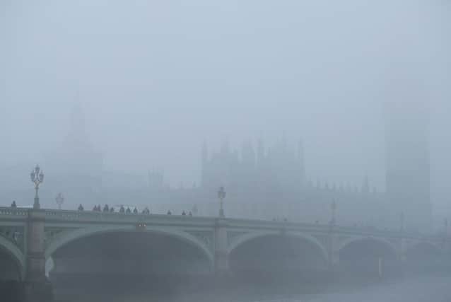 Westminster is shrouded in fog, as the weather causes travel disruption across England