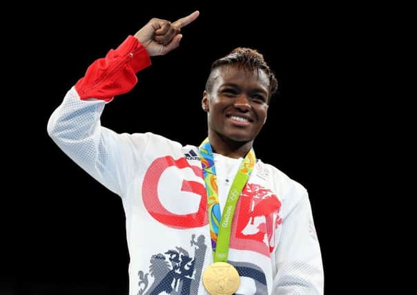 Leeds's Nicola Adams with her gold medal following victory over France's Sarah Ourahmoune in the women's flyweight final at the Rio Olympics (Picture: Owen Humphreys/PA Wire).