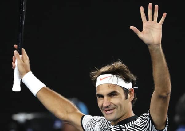Switzerland's Roger Federer celebrates after defeating Germany's Mischa Zverev at the Australian Open. (AP Photo/Dita Alangkara)