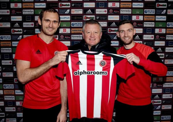 Sheffield United's James Hanson, left,  and Jay O'Shea of with Blades boss Chris Wilder. Picture: Simon Bellis/Sportimage