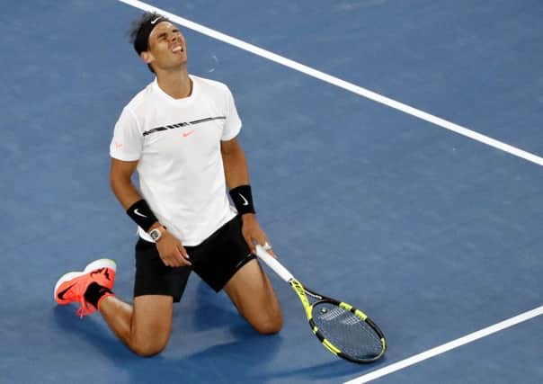 Spain's Rafael Nadal celebrates after defeating Canada's Milos Raonic in the Australian Open. Picture: AP/Dita Alangkara.