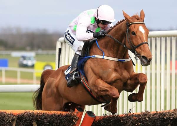 Annie Power ridden by Jockey Ruby Walsh on the way to winning the Doom Bar Aintree Hurdle during the Grand Opening Day of the Crabbie's Grand National Festival.
