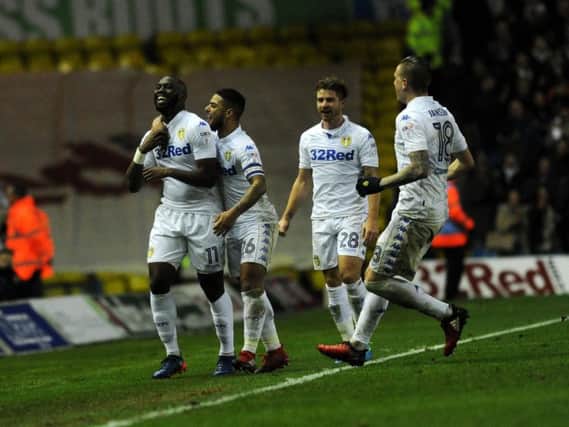 Souleymane Doukara is greeted by his Leeds United teammates after scoring his wonder goal