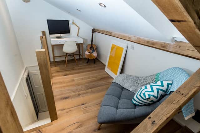 The loft reworked as a bedroom and reading nook