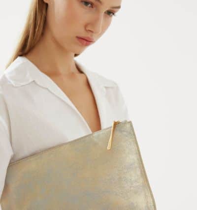 THE OVERSIZED BAG: Cotton poplin shirt, Â£98; Alana large leather pouch, Â£65. Both from Jigsaw.