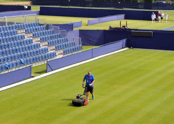 Helping hand: Head groundsman Richard Lord prepares the courts at Ilkley.