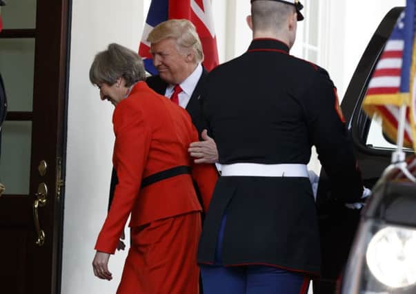 President Donald Trump welcomes British Prime Minister Theresa May to the White House in Washington, Friday, Jan. 27, 2017. (AP Photo/Evan Vucci)