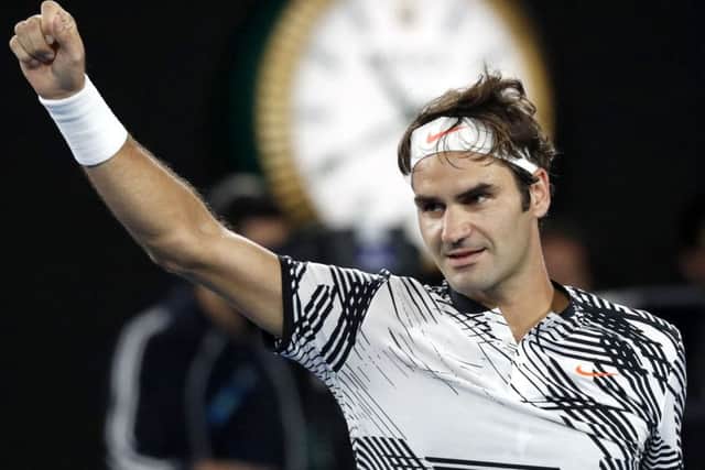 Switzerland's Roger Federer celebrates after defeating compatriot Stan Wawrinka in 2017. (AP Photo/Kin Cheung)
