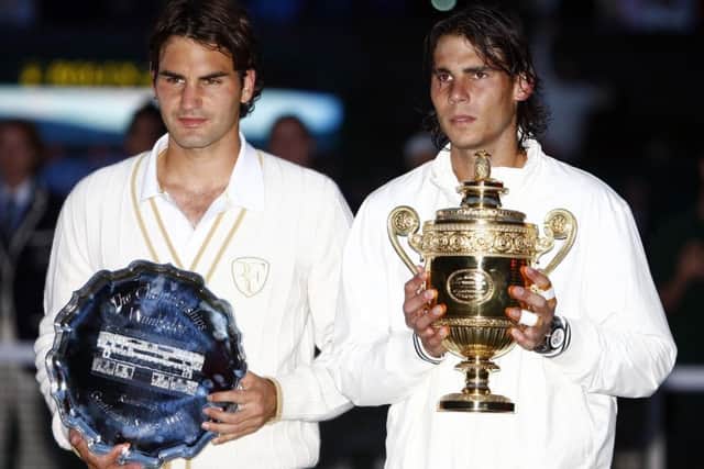 Spain's Rafael Nadal (right) and Switzerland's Roger Federer with their trophies following the Men's Final during the Wimbledon Championships 2008.
