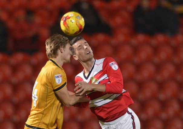 Doncaster Rovers' Mathieu Baudry, right. Picture: Bruce Rollinson