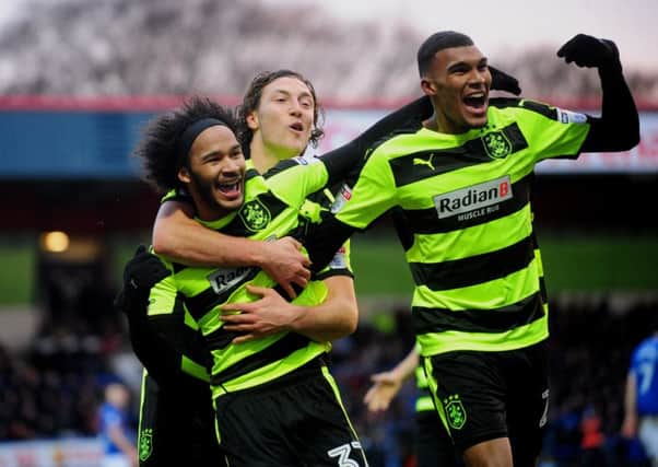 Huddersfield Town's penalty-taker Izzy Brown is hugged by Michael Hefele, who went on to score twice in the 4-0 win over Rochdale (Picture: Simon Hulme).