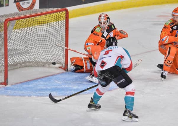 Mike Quesnele fires home into an empty Steelers' net to make it 2-0 to Belfast. Picture: Dean Woolley.