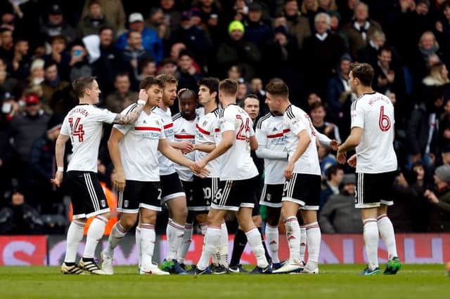 Fulham's Chris Martin (second left) celebrates scoring his side's second goal. Picture: Paul Harding/PA