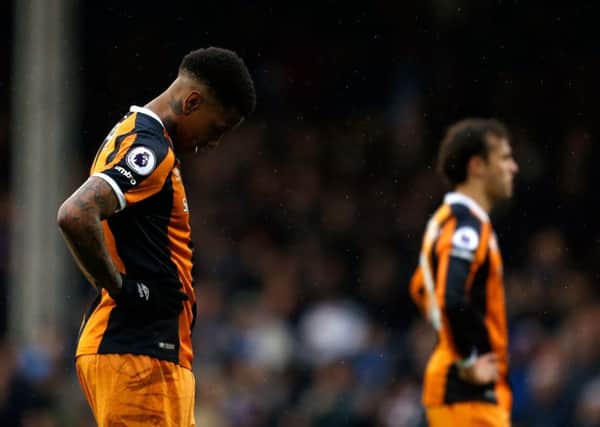 Hull City's Abel Hernandez, left, looks dejected after missing two penalties during the FA Cup defeat at Fulham (Picture: Paul Harding/PA Wire).