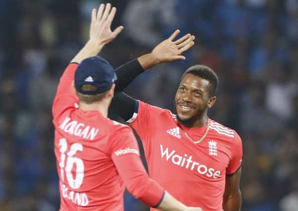 England's Chris Jordan, right, celebrates the wicket of India's Virat Kohli.
