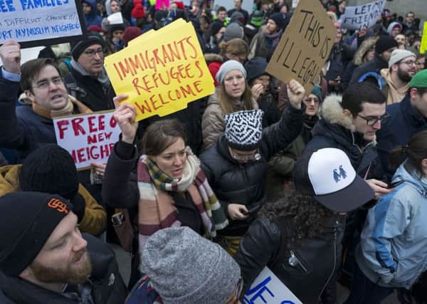 Protests grow in America over Donald Trump's travel ban.