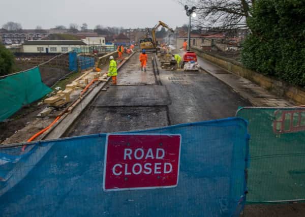 Date: 31st January 2017.
Picture James Hardisty.
Ongoing construction work to Tadcaster Bridge, which was severely damaged by the 2015 Boxing Day Floods, and was due to reopen today (Tuesday 31st January).