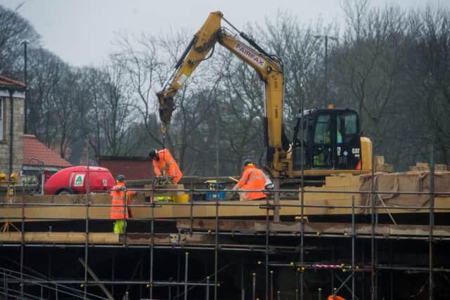 Date: 31st January 2017.
Picture James Hardisty.
Ongoing construction work to Tadcaster Bridge, which was severely damaged by the 2015 Boxing Day Floods, and was due to reopen today (Tuesday 31st January).