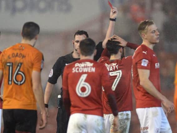 Alex Mowatt is shown a red card 41 minutes into his career at Barnsley