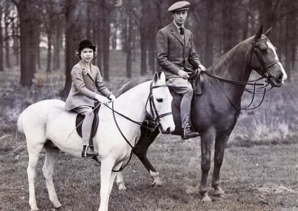 King George VI with a young Princess Elizabeth.