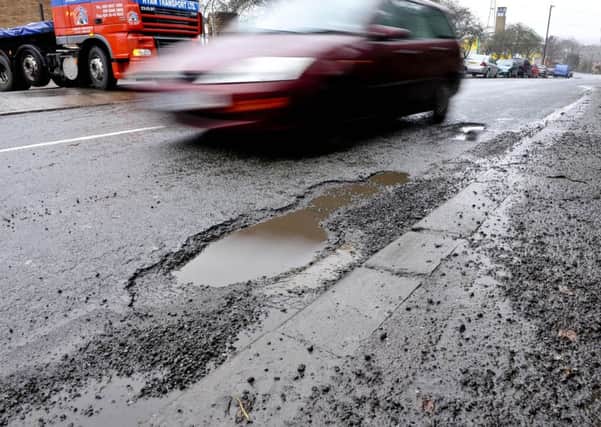 Stock image of a pothole. Lee Crawley from Barnsley sued his local council after tripping while out jogging.