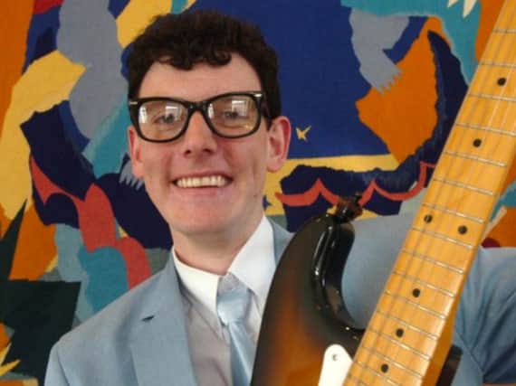 Andrew Morley as his idol Buddy Holly
