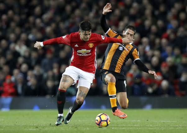 Manchester United's Marcos Rojo (left) and Hull City's Goebel Evandro battle for the ball.