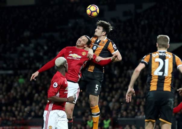 Manchester United's Zlatan Ibrahimovic (left) and Hull City's Harry Miguire battle for the ball.