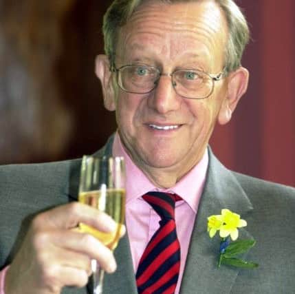 Sir Ken Morrison raises his glass at a Marie Curie charity lunch held at Rudding Park Harrogate