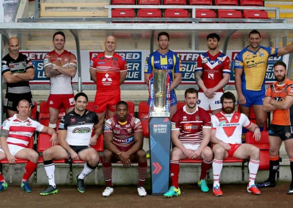 Super League captains pose for a photograph with the Betfred Super League trophy during the 2017 Betfred Super League launch at Leigh Sports Village. (Picture: Richard Sellers/PA Wire).