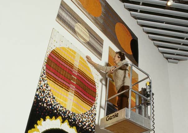 Lucienne Day with her 1990 Aspects of the Sun silk mosaic wall hagning, made for the new John Lewis store at Kingston. It is still on display.