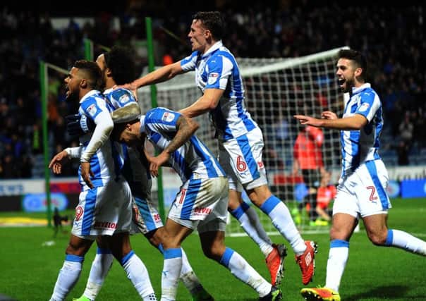 Huddersfield Town players celebrate Elias Kachungas goal, their third of the night as they defeated Championship leaders Brighton 3-1 (Picture: Jonathan Gawthorpe).