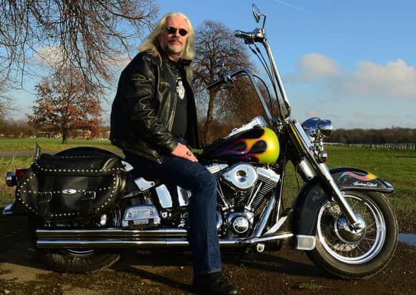 Rebel  with a cause: Aslef president Tosh McDonald on his Harley Davidson.