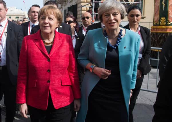 Angela Merkel and Theresa May arrive in Malta for a meeting of EU leaders.