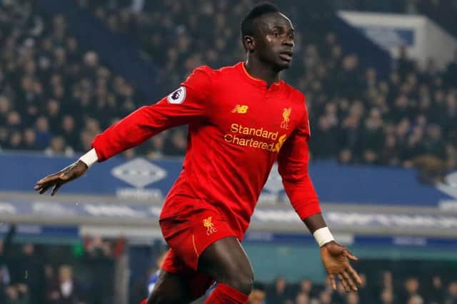 Liverpool's Sadio Mane celebrates scoring his side's first goal of the game during the Premier League match at Goodison Park, Liverpool.