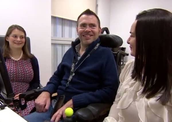 Jason Liversidge smiles as he hears his voice for the first time, as the 41-year-old father who has motor neurone disease will be able to keep his Yorkshire accent despite the fact he is losing the ability to speak. PIC: PA