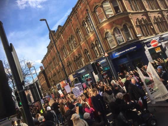 Protesters marching on Briggate, Leeds city centre. Pic: Leeds SUTR.