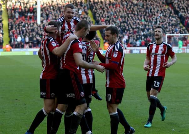 James Hanson celebrates with his new team-mates after scoring his first goal for Sheffield United (Picture: Jamie Tyerman/Sportimage).