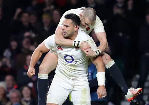 England's Ben Te'o celebrates scoring the match-clinching try with team-mate Mike Brown.