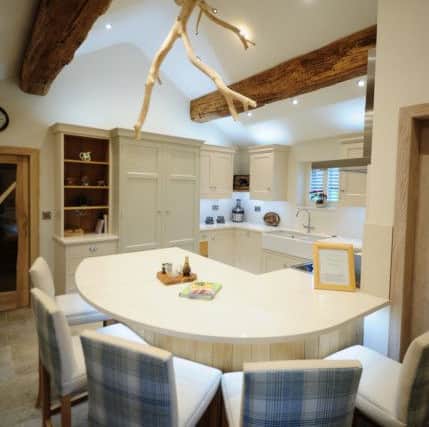 The dining room with bespoke table and branch lights