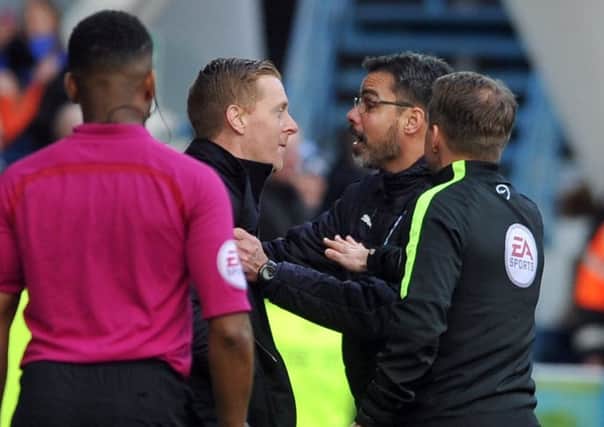 Huddersfield Town head coach David Wagner, right, and his Leeds United counterpart Garry Monk clash on the touchline ( Picture: Tony Johnson).