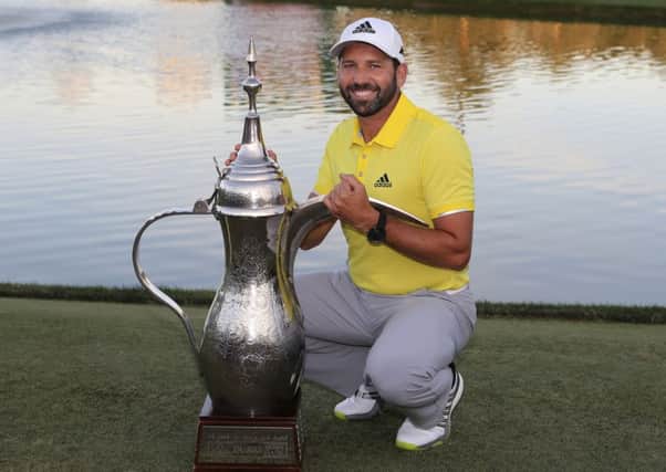 Spain's Sergio Garcia poses with the trophy after he won the Omega Dubai Desert Classic (Picture: Kamran Jebreili/AP).