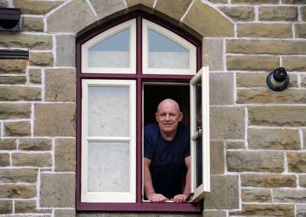 Builder Dave Anderson from Widnes who had barricaded himself inside Ribblehead  Station Master's House on one of Yorkshire's best loved railways, leaves the building after he mounted a peaceful protest against Network Rail who he claims owes him thousands of pounds after works on the property. Picture Tony Johnson.