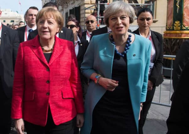 Germany's Angela Merkel joins Theresa May on a walkabout at last Friday's gathering of EU leaders in Malta.