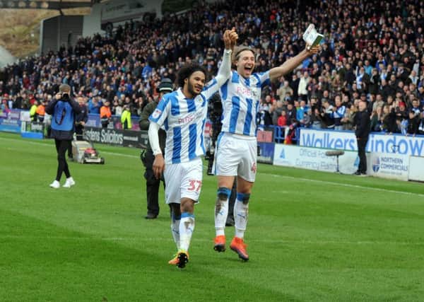 Huddersfield Town goalscorers Isaiah Brown and Michael Hefele celebrate the win at the end of the match. Picture: Tony Johnson.