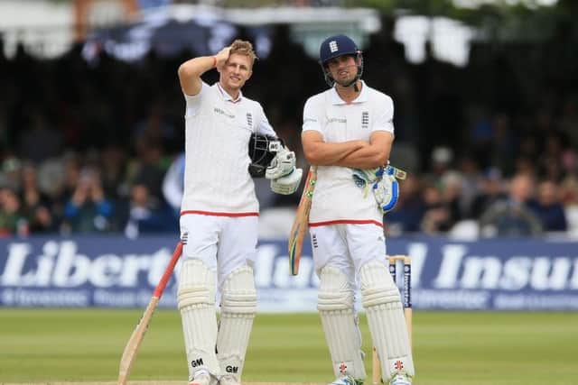 OVER TO YOU JOE? Favourite for the England Test captaincy role, Joe Root, and Alastair Cook, who quit on Monday. Picture: PA.